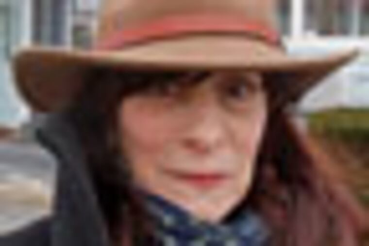 Dyanne DiSalvo is standing by the gun shop " Rayco Armory" in Merchantville, NJ. 01/18/2012 (Akira Suwa / Staff Photographer ) JRIORDAN24-B 126716 AS EDITOR'S NOTE -- Dyanne DiSalvo, a published author of children's books, lives in Merchantville and is upset about a new neighbor --a gun shop.