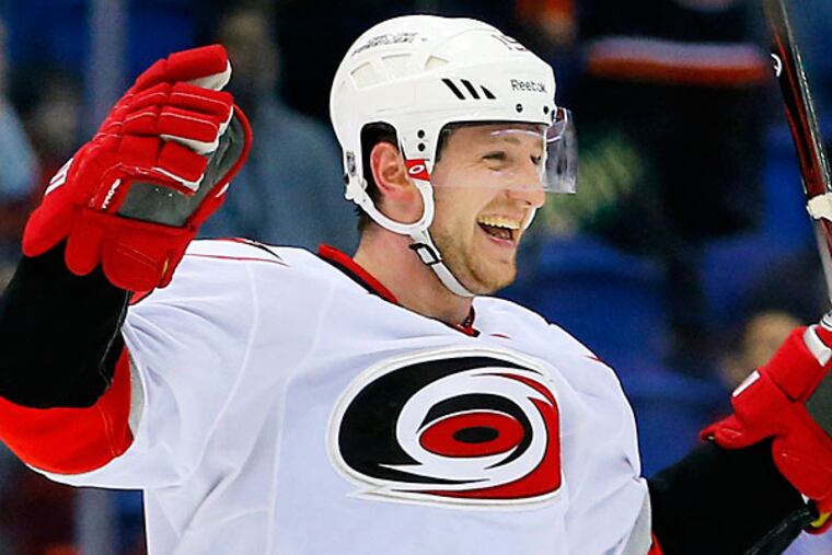 Jiri Tlusty scored twice and had two assists for the Hurricanes to send the Islanders to a 6-4 loss. (Paul J. Bereswill/AP)