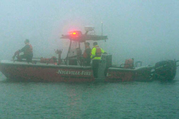 ASSOCIATED PRESSGrim mission A rescue boat is shrouded in fog near Navarre Beach, Fla., where an Army Black Hawk helicopter crashed Tuesday evening carrying 11 service members. Fighting the fog, it was still considered a search and rescue mission yesterday, although all aboard were presumed dead.