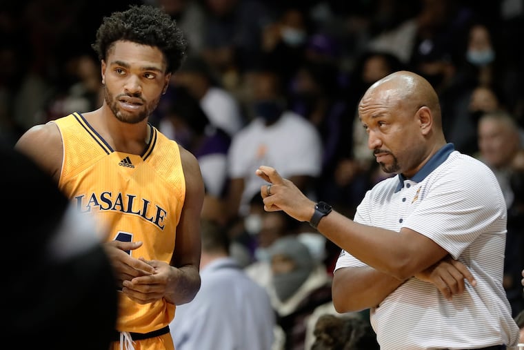 La Salle’s #4 Sherif Kenney listens as head coach Ashley Howard has his fingers crossed during the University of Albany at La Salle University mens NCAA basketball game at La Salle’s Tom Gola Arena in Phila., Pa. on Nov. 13, 2021.