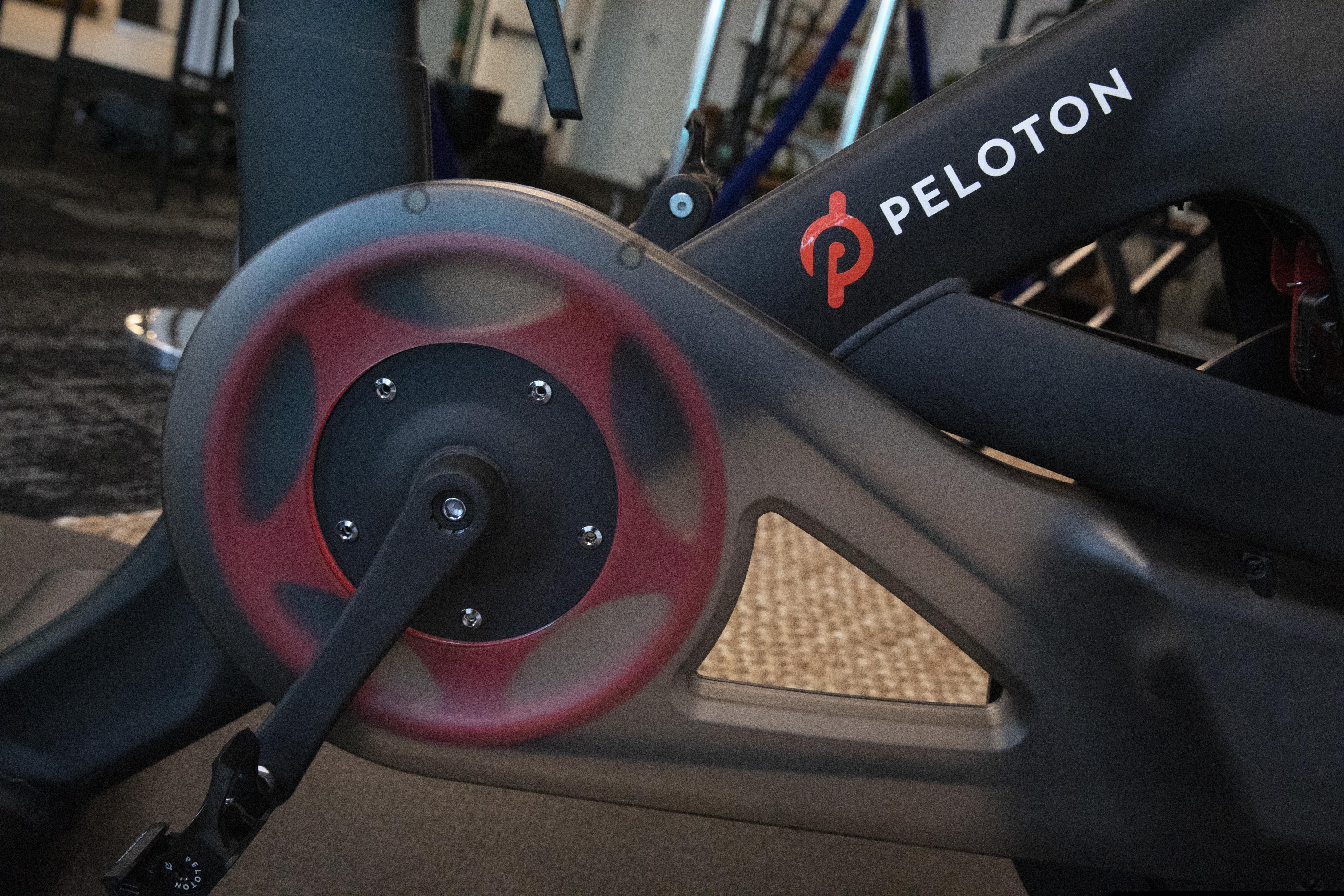 The Peloton logo is displayed on the company's stationary bicycle, Thursday, Sept. 26, 2019 in New York. (AP Photo/Mark Lennihan)