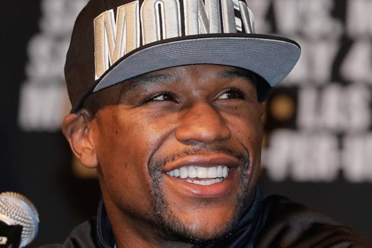 Boxer Floyd Mayweather Jr. reacts during a news conference, Wednesday, May 1, 2013, in Las Vegas. Mayweather will defend his WBCd welterweight title against Robert Guerrero on Saturday. (Julie Jacobson/AP)
