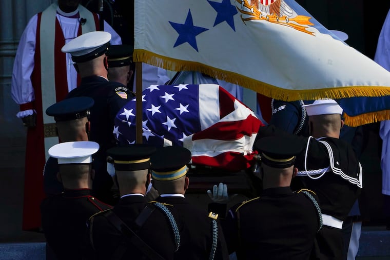 The flag-draped casket of former Secretary of State Colin Powell is carried into the Washington National Cathedral for a funeral service in Washington, Friday, Nov. 5, 2021.