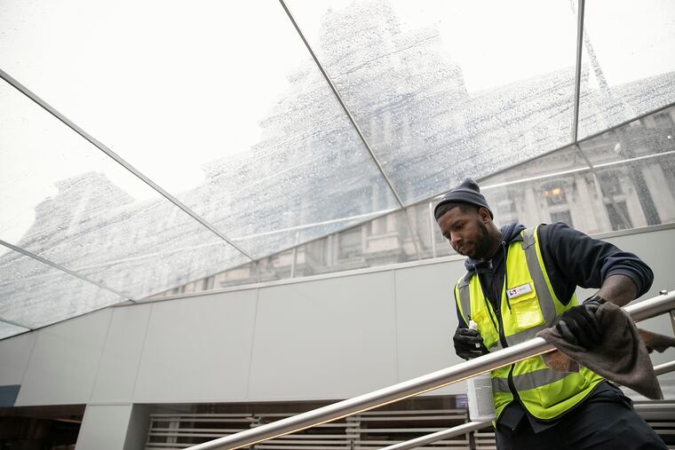 John Mathis, a SEPTA employee, disinfects the rails at the 15th street station on the Broad Street line on Friday, March 06, 2020. The cleaning is happening frequently for COVID-19 response.