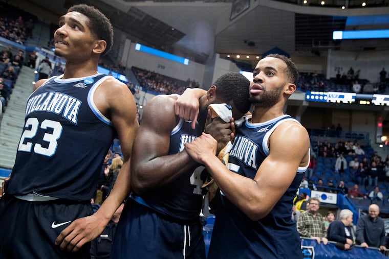 L-R; Jermaine Samuels, Eric Paschall, and Phil Booth of Villanova in the final moments of their loss to Purdue in the 2nd round NCAA Tournament game at the XL Center in Hartford, CT on March 23, 2019.