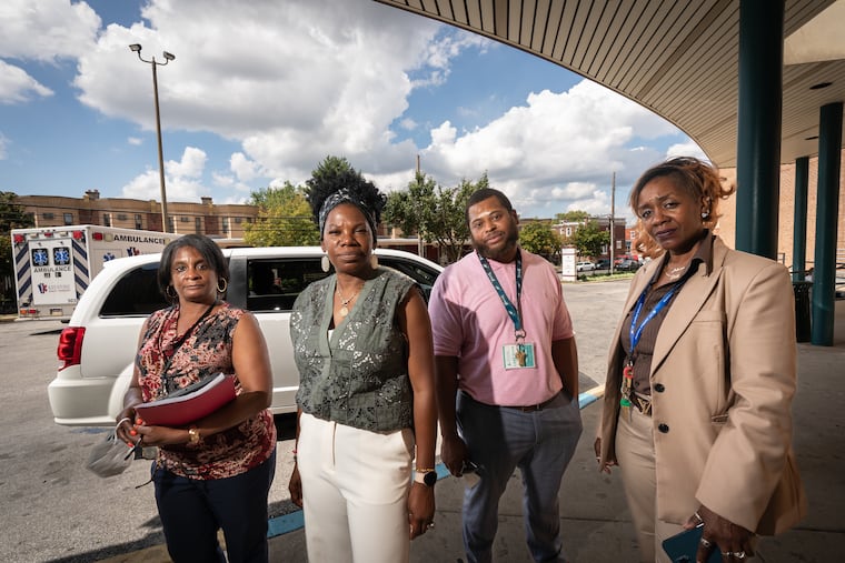 Teralynn Turner, Crisis Intervention counselor; Dawn M. Curry, divisional director of Behavioral Health Services; Cedric McNear, Mobile Care Team counselor; and Adriane Y. Parks, director of the Mobile Crisis Unit, at HUP at Cedar Hospital after dropping off a client. All are staff of The Consortium in West Philadelphia.