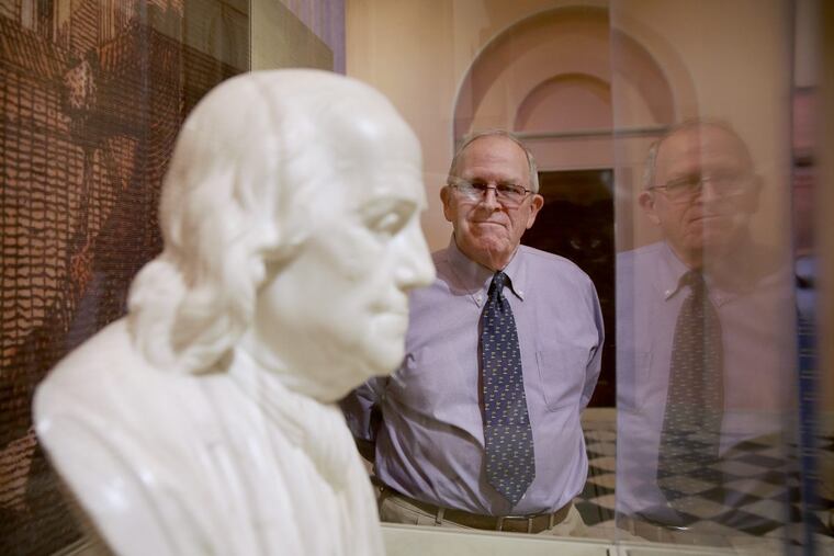 Bob Giannini stands next to a bust of Benjamin Franklin inside the portrait gallery at the Second Bank of the United States. Decades ago, Giannini helped transport the bust, a gift to the museum, from the Main Line in the back of a station wagon.
