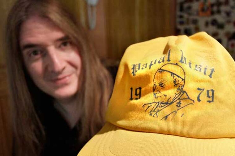 John M. Verica is selling this yellow baseball cap his grandfather, John E. Verica, wore when he worked as a security guard for the pope during his 1979 visit. It was on his head when the pope blessed him. Now it's on ebay for $100. (Elizabeth Robertson / Staff Photographer)