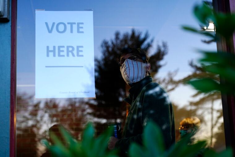 A voter lines up in a polling place to cast a ballot for the 2020 general election in the United States in Springfield, Pa. U.S. voters went to the polls starkly divided on how they see President Donald Trump’s response to the coronavirus pandemic, with a surprising twist. In places where the virus is most rampant now, Trump enjoyed enormous support.