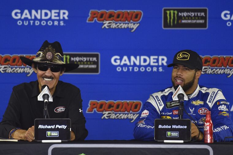 NASCAR Hall of Famer and car owner Richard Petty, left, and Bubba Wallace answer questions during a media availability for Sunday's NASCAR Cup Series auto race, Saturday, July 28, 2018, in Long Pond, Pa. (AP Photo/Derik Hamilton)