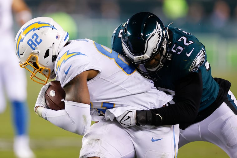 Eagles linebacker Davion Taylor stopping Los Angeles Chargers tight end Stephen Anderson on Sunday.
