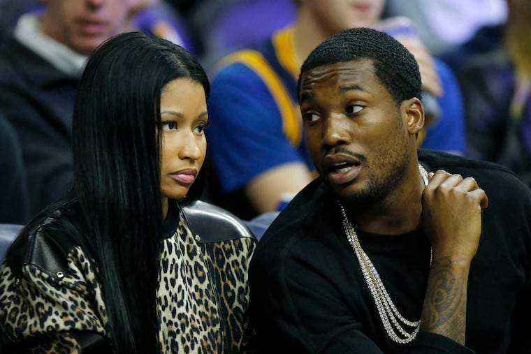 Meek Mill and Nicki Minaj attend a Sixers game in 2016.