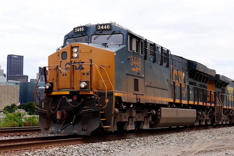 A CSX freight train rolls past downtown Pittsburgh in June. Paul C. Hilal, an activist investor who recently took on Aramark, is on CSX's board. His firm owns CSX shares that were worth nearly $3 billion in June, the last official tally of his CSX holdings.