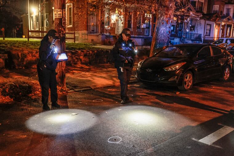Police investigators on the scene where a 53-year-old man was fatally shot on the 1200 block of West Allegheny Avenue Wednesday night.