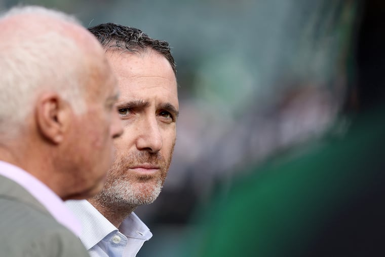 Eagles owner Jeffrey Lurie (left) and general manager Howie Roseman have some decisions to make as the NFL's free agency period gets underway.