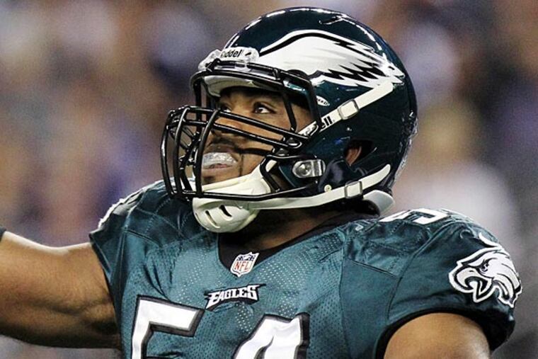 Philadelphia Eagles defensive end Brandon Graham gestures after
sacking Dallas Cowboys quarterback Tony Romo during the first half of
an NFL football game, Sunday, Dec. 2, 2012, in Arlington, Texas. (AP
Photo/LM Otero)