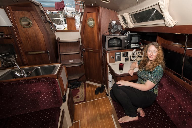 Claire McKellar, is photographed inside her 1989 Catalina 34 feet sailboat, at the Pier 3 Marina on 31 N. Columbus Blvd. in Philadelphia. About 20 people live year-round on boats on the Delaware river at Pier 3.