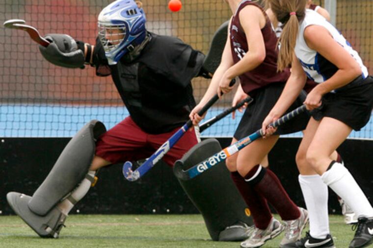 Kiera Kenney (right) of Central Bucks South scoring against Stroudsburg in the state Class AAA playoffs. Her shot beat goalie Lauren Williams and defender Brenna Stewart.