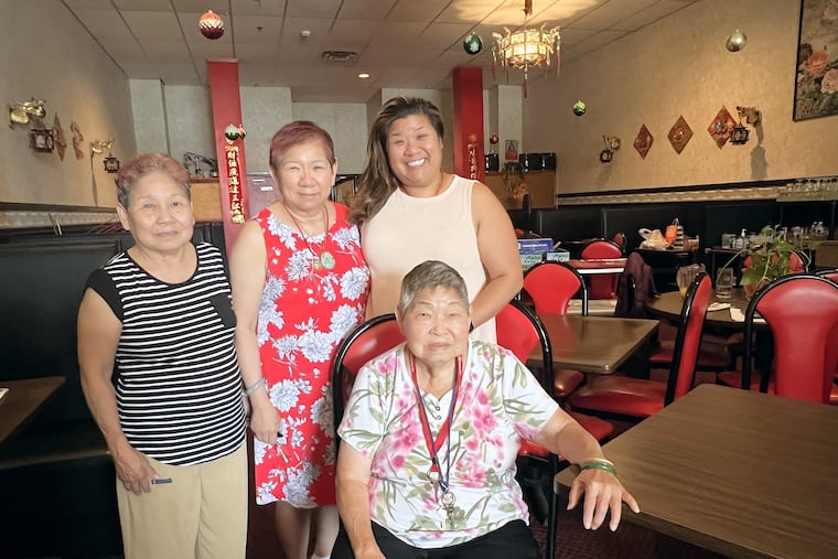 Golden Dragon restaurant will close on Sept. 16. In the dining room are June Wong (left) and her sister, matriarch Lang Vuong (seated). At center is Vuong's daughter Susan Thuha Long, next to her daughter Jennifer Hua.