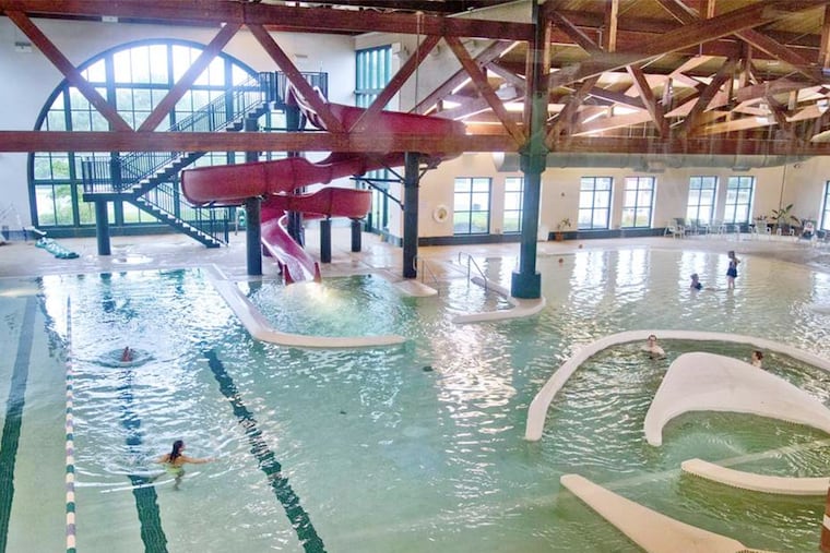 The swimming pool with water slide, walking track, and wading pool at the RiverWinds community center in West Deptford.