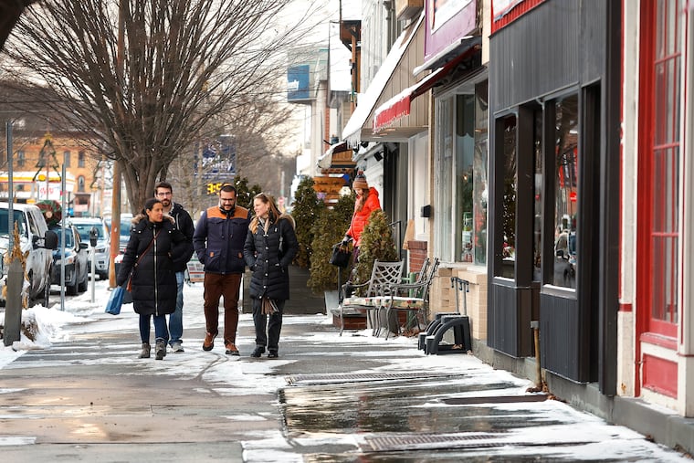 Consumers browse the shop windows as they walk down Main Street in Honesdale, Pa., on Dec. 21, 2024. The postelection economic outlook has created optimism among small businesses, but challenges remain ahead.