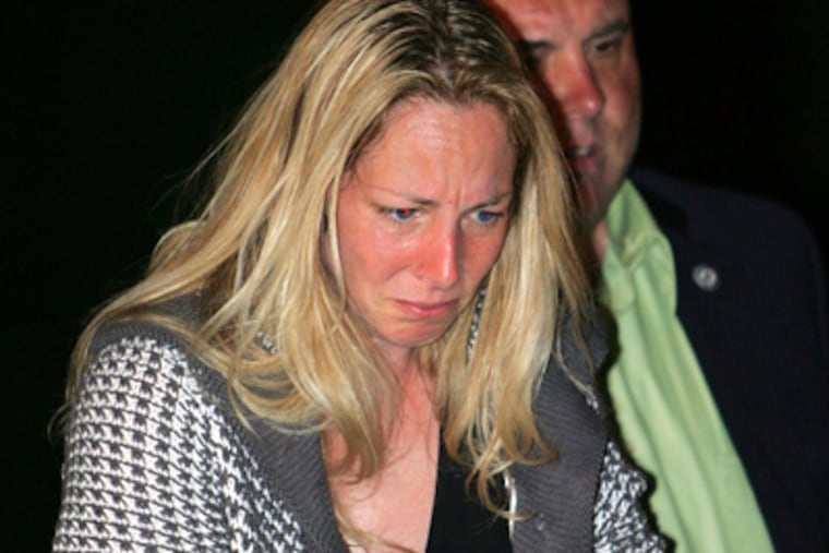 Bonnie Sweeten, in the custody of Bucks County Detectives and Upper Southampton Detectives, is escorted into District Court on May 29. (David Swanson / Staff File Photo)