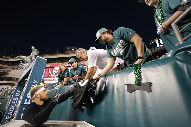 Eagles tight end Zach Ertz sign his autograph for fans before the Eagles play the Tampa Bay Buccaneers on Thursday, October 14, 2021 in Philadelphia.