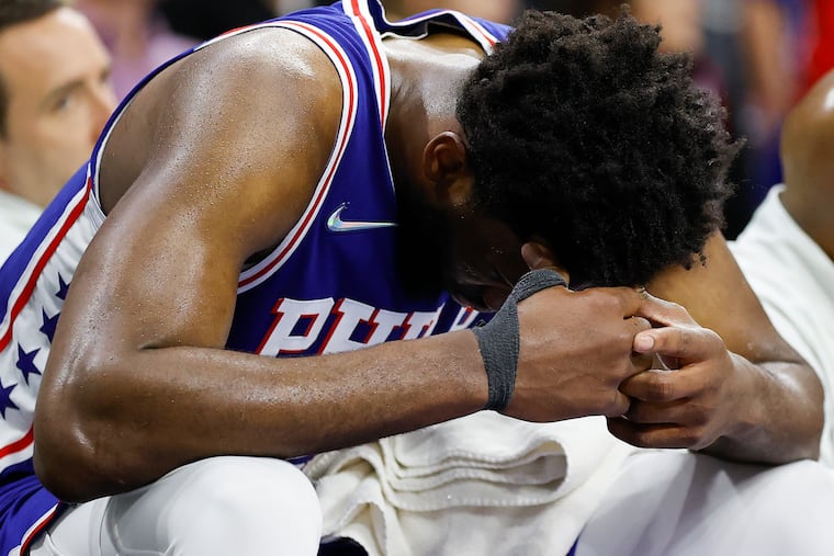 All-Star center Joel Embiid is a picture of dejection after the Sixers lost their second-round Eastern Conference playoff series to the Miami Heat.