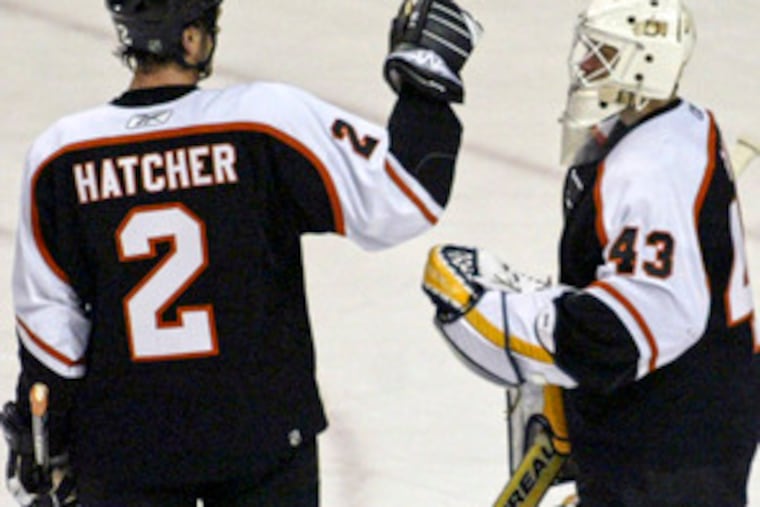 "I've started to learn the area better, " says Flyers goalie Martin Biron, shown with Derian Hatcher. "You don't rush things."