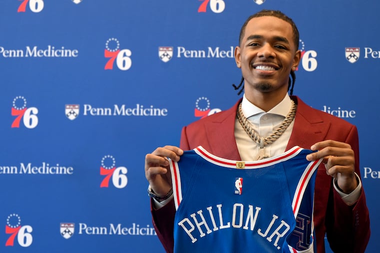Sixers first round draft pick Labaron Philon Jr. poses with his jersey after he was introduced during a news conference at the 76ers practice facility.