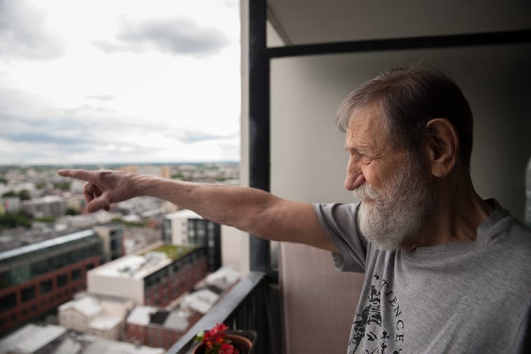 Robert Mellin, known as "Uncle Rocky" to friends and family, shows the view from his apartment at 13th and Lombard streets, June 5, 2017. Mellin is about to embark on a three month journey to Cambodia, Laos, Vietnam, and Thailand.