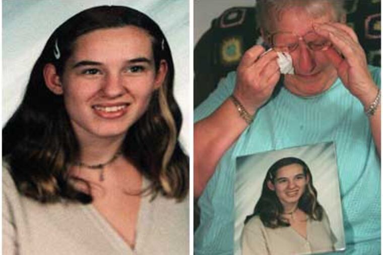 Louise Hamlin, right, cries as she holds a picture of her granddaughter, Megan Hamlin, who died after 10 years in a coma brought after she was run over by an SUV in Florida in 2000.