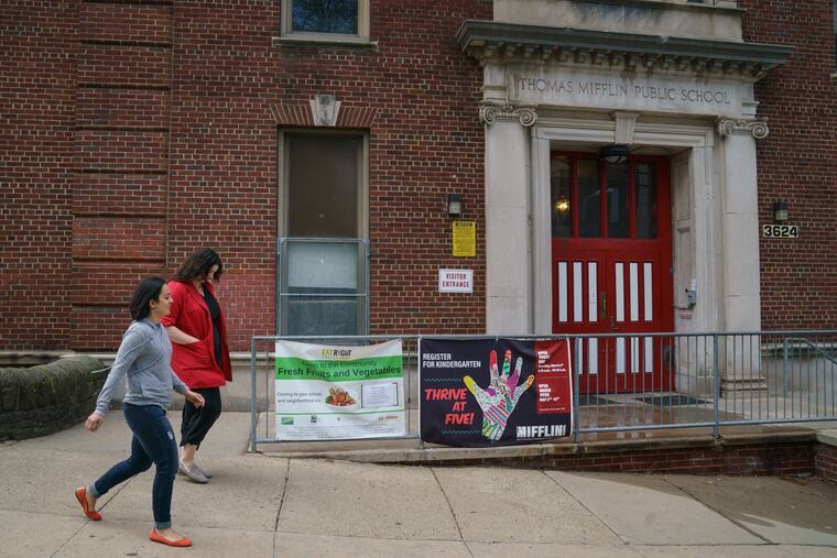 Carla Lewandowski, left, and Mary Alice Duff, right, are committed to Mifflin Elementary. They're worried that a charter school trying to move into the neighborhood could drain students from their school, they are shown here at Mifflin Elementary school in East Falls.