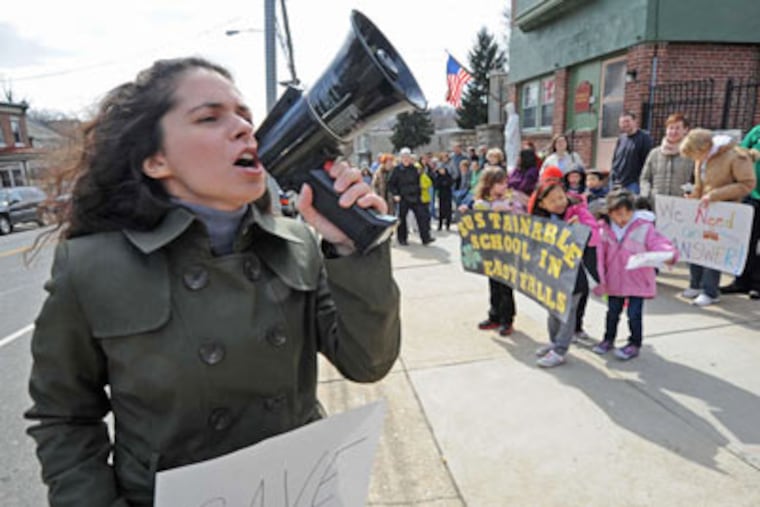 Christina Spino , a 1999 graduate of St. Bridget's in East Falls, leads a rally against the plan to close it. (April Saul /Staff Photographer)