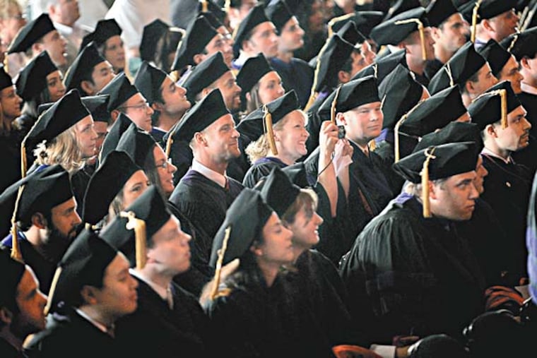 The commencement of Rutgers School of Law/ Camden was held at Susquehanna Bank Center in Camden. In their caps and gowns the graduating class of 1,431 watched and took photos as speakers went up on stage. ( Sharon Gekoski-Kimmel / Staff Photographer ) May 21, 2010. Editors Note: JGRAD25 2/6