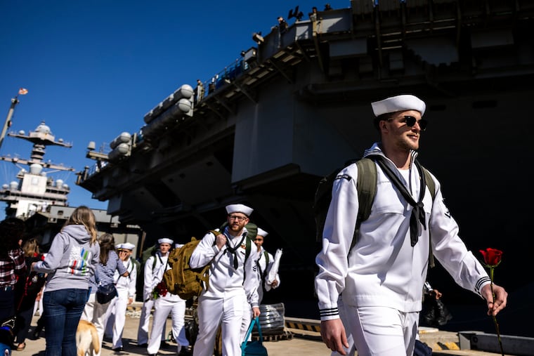 Sailors make their way to their loved ones after disembarking from the USS Gerald R. Ford at Naval Station Norfolk in Norfolk, Va. on Saturday, May 16, 2026, following an 11 month deployment.