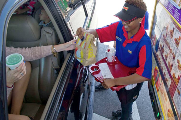 At the Sonic in East Norriton, Sacoya Jones delivers - on skates. The recession was rocky for two local partners, but they have big plans.
