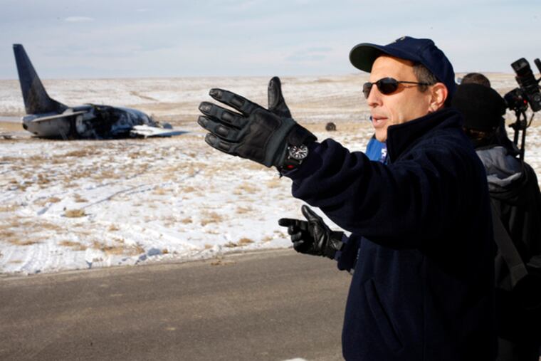 Bill English, an investigator with the National Transportation Safety Board, at the site of Saturday's jet accident in Denver.