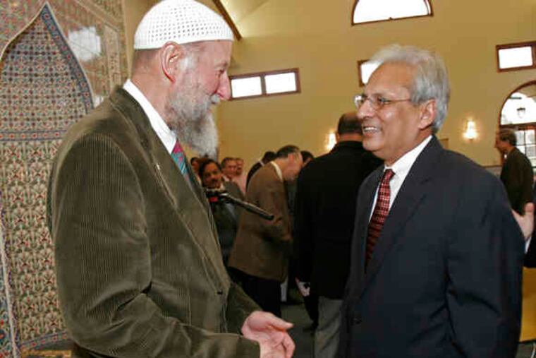 Zia Rahman (right) at a program honoring the 2006 opening of the Voorhees mosque, whose construction he spearheaded.