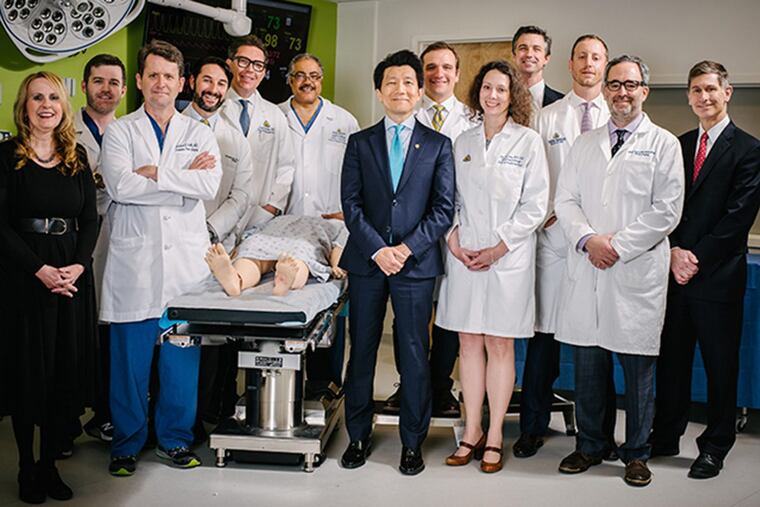 The Johns Hopkins’ team that performed the penis transplant was led by W.P. Andrew Lee (center, aqua tie) and included Cooper surgeon Steven Bonawitz (right, red tie.)