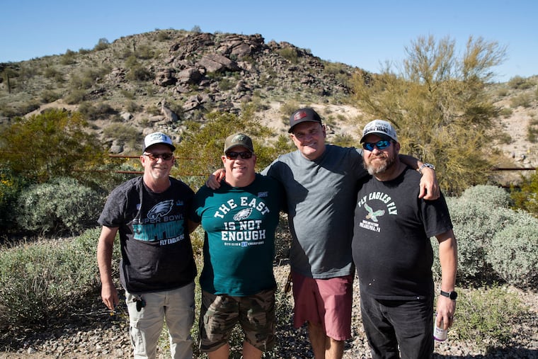 (From left) Tom (no last name given), Denny Alessandrine, Jim Wallin and Mike Daggett, all originally from Southwest Philadelphia, posed for a portrait at the Pima Canyon Trailhead in Phoenix on Wednesday, February 8, 2023. A number of Southwest Philly men in recovery have moved to Arizona to live a different sober life.