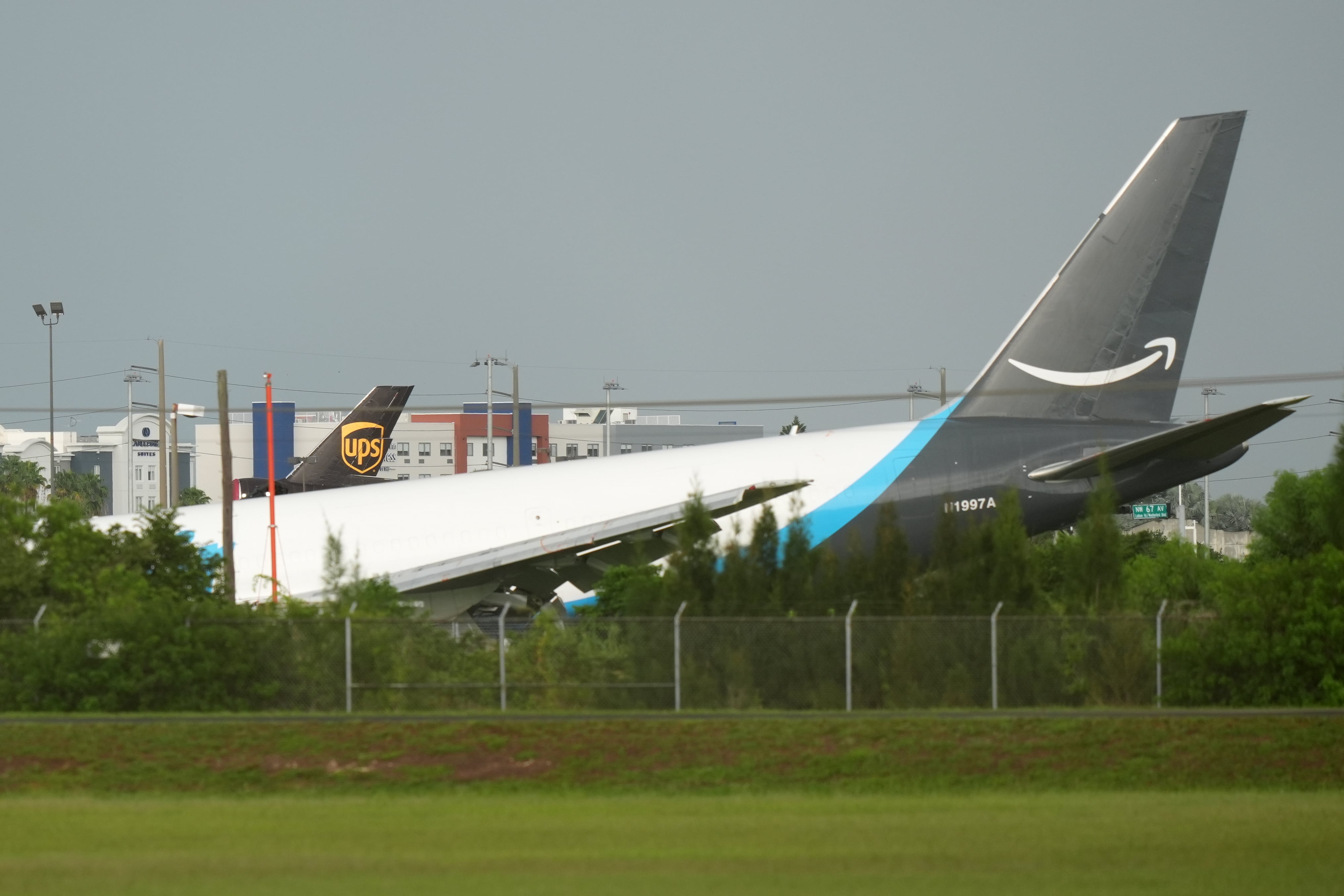 Amazon cargo plane sends up cloud of smoke after overrunning runway at Miami airport