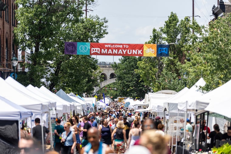 Thousands gather along Main Street for the Manayunk Arts Festival in June 2025. Organizers say that the event has gone from profitable to barely break even as the cost of police traffic and crowd controls has skyrocketed.