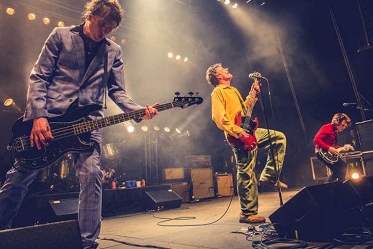 Tommy Stinson (left) and Paul Westerberg of the Replacements, once infamous for showing up drunk to concerts that often ended early, played Festival Pier at Penn's Landing with a relatively tidy set. DAN DeLUCA / Staff
