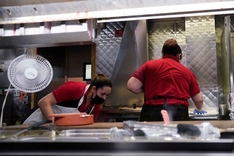 Women work in a restaurant kitchen in Chicago earlier this year