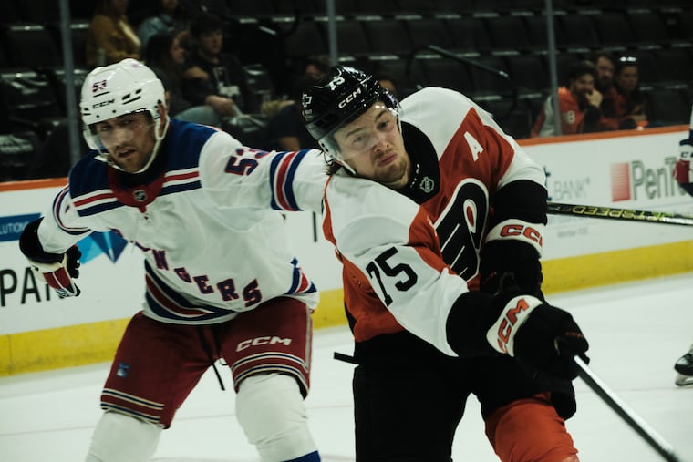 Ethan Samson of the Flyers moves the puck up the boards during Friday's prospects game against the Rangers.