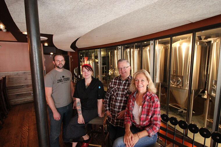 The crew at 2nd Story Brewing Co. (from left): Brewer John Wible, chef Rebecca Krebs, general manager Ken Merriman and owner Debbie Grady. (MICHAEL KLEIN / Philly.com)
