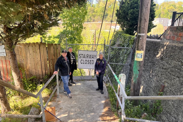 Leonard Gryn (left), a lifelong Manayunk resident; Vicki Beechler (center), president of Wissahickon Neighbors Civic Association; and Suzanne Hagner (right), a member of the 5th Square transportation advocacy group, who also lives in Manayunk, gathered at the stairs.