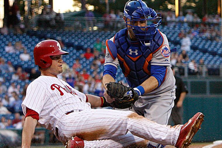 The Phillies' Reid Brignac is tagged out at home plate by Mets catcher Travis d'Arnaud. (Ron Cortes/Staff Photographer)