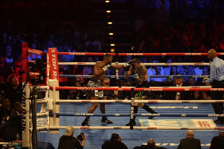 Jesse Hart (left) and Joe Smith Jr. face off during the main event, the light heavyweight battle, Saturday night in Atlantic City.